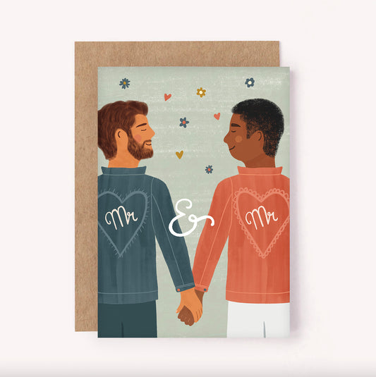 Celebrate the union between two grooms with this "Mr. & Mr." wedding greeting card. Features an illustrated couple in matching embroidered jackets, holding hands on their happy day
