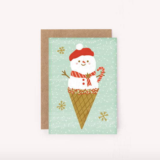 Cute illustrated mini Christmas card, Ms Snow Cone is perfect for spreading some holiday spirit. She has her candy cane, beret, scarf and is decorated with sprinkles. Mint green background with spinkles and gold snowflakes