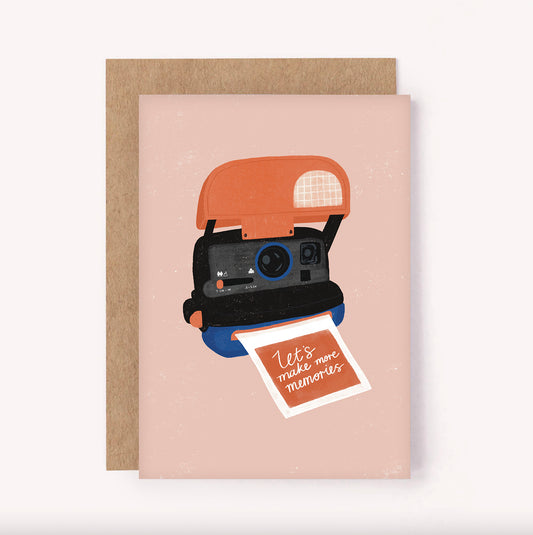 this illustrated greeting card features a retro 90's instant camera with the greeting "Let's Make More Memories" handwritten on a polaroid. Perfect for a friend, Valentines Day or an anniversary
