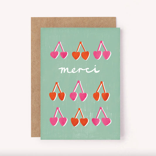 Bold, retro illustrated pink and red cherries adorn this "Merci" thank you greeting card. With a striking blue background, this card is perfect for showing some gratitude and brightening someone's day
