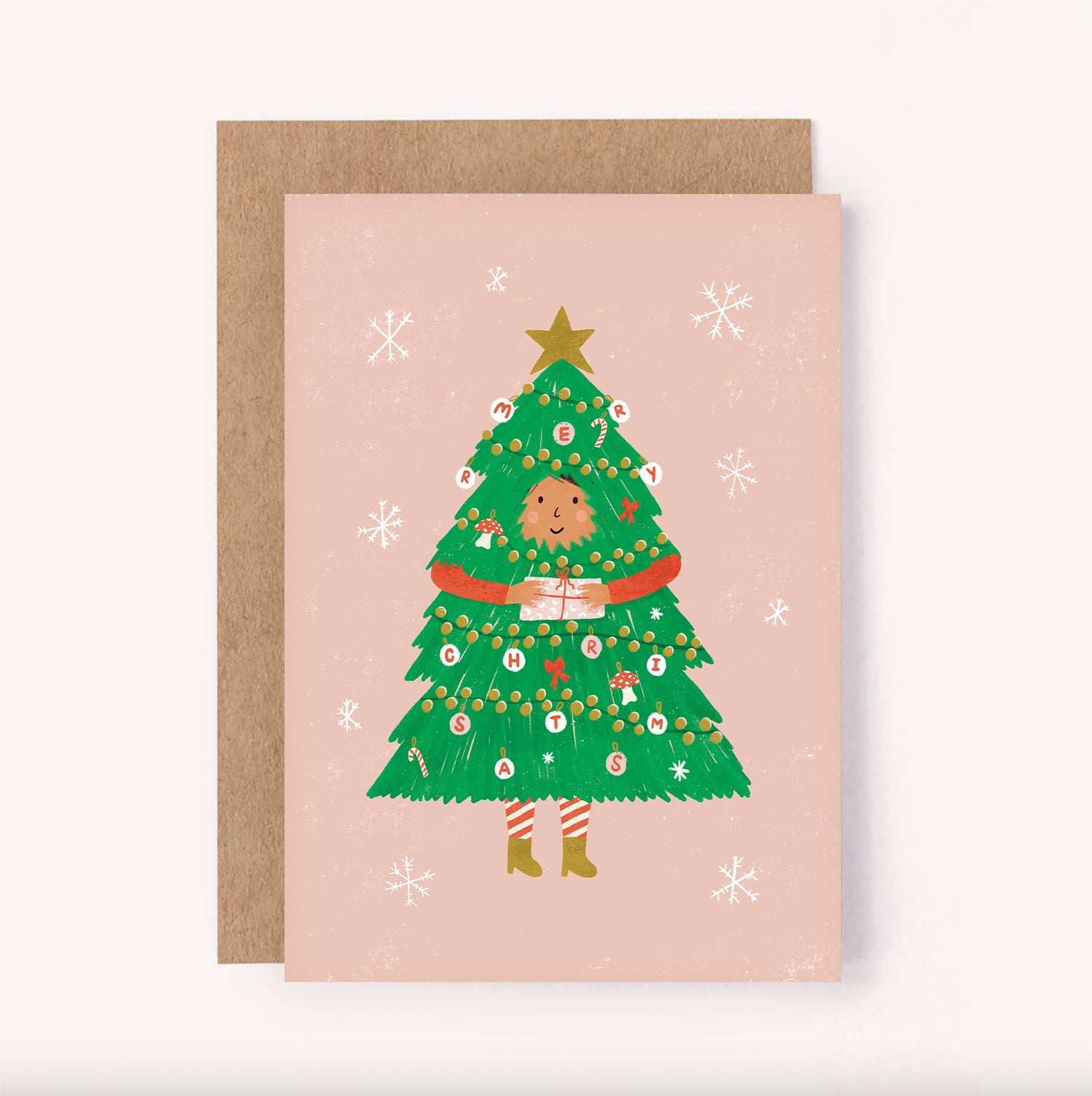 Cute illustrated Christmas card. Pink background with a girl dressed as an Xmas tree, decorated with mushroos, ribbons, candy canes and baubles